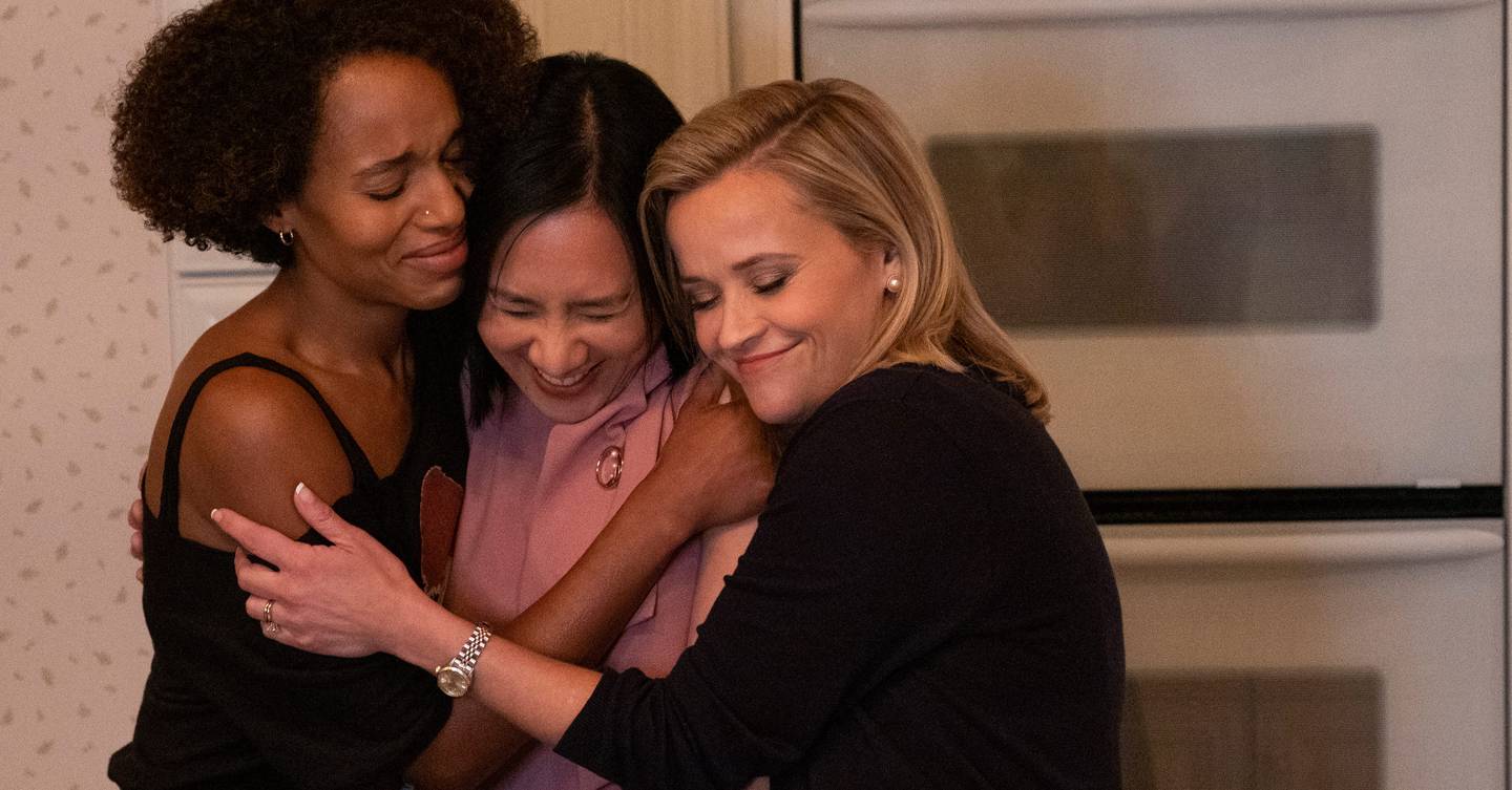 Kerry Washington, Celeste Ng and Reese Witherspoon are in a group hug.